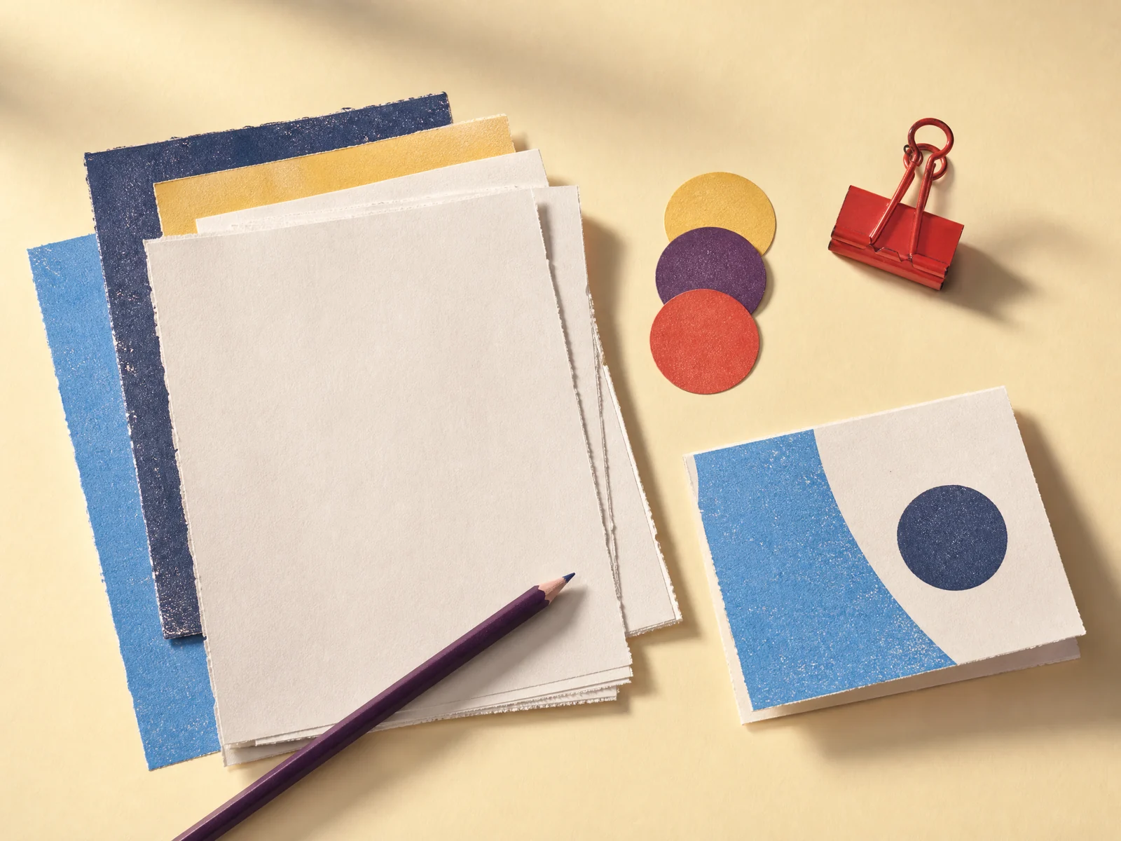 An independent marketing editor desk with manuscript pages and colour registration circles